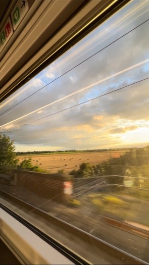 A view outside the train window on a train travelling from London to Edinburgh.